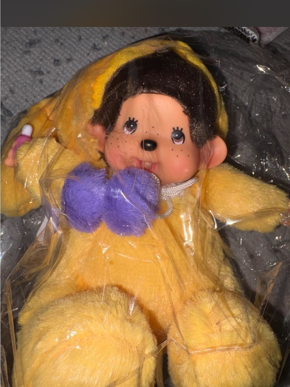 Monchichi in yellow pompom outfit